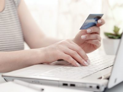 Female hands with credit card